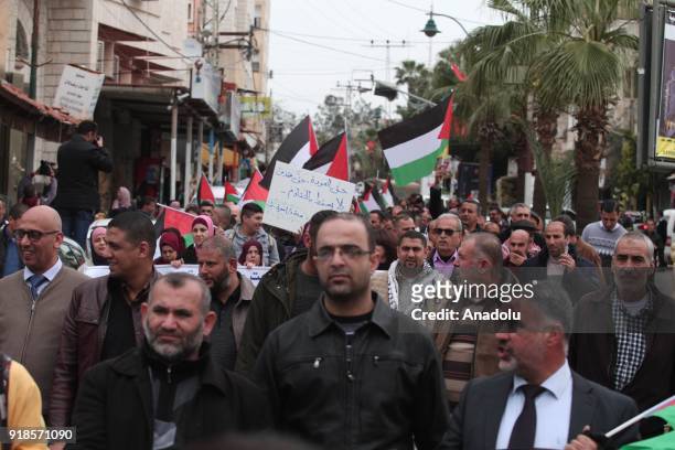 Palestinians stage a protest against U.S. Move to cut funding for the Palestinian Authority and UN refugee agency UNRWA in Qalqilya, West Bank on...