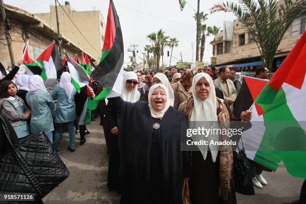 Palestinians stage a protest against U.S. Move to cut funding for the Palestinian Authority and UN refugee agency UNRWA in Qalqilya, West Bank on...