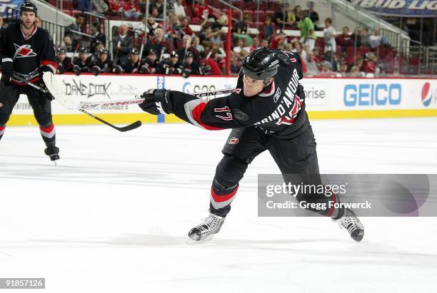 Rod Brind'Amour of the Carolina Hurricanes shoots the puck and scores on a one timer during a NHL game against the Florida Panthers on October 9,...
