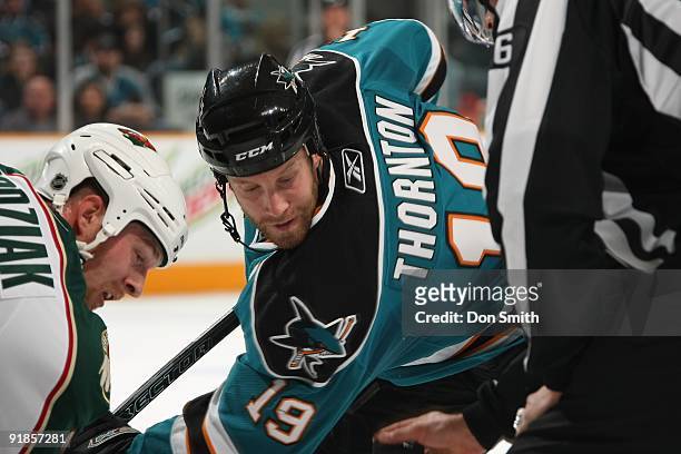 Kyle Brodziak of the Minnesota Wild takes a faceoff against Joe Thornton of the San Jose Sharks during an NHL game on October 10th, 2009 at HP...