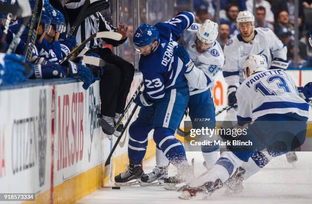 Travis Dermott of the Toronto Maple Leafs battles for the puck against Cory Conacher of the Tampa Bay Lightning during the second period at the Air...