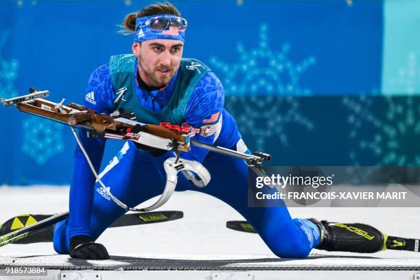 S Sean Doherty competes at the shooting range in the men's 20km individual biathlon event during the Pyeongchang 2018 Winter Olympic Games on...