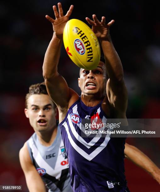 Danyle Pearce of the Dockers and Karl Amon of the Power compete for the ball during the AFLX match between the Port Adelaide Power and the Fremantle...
