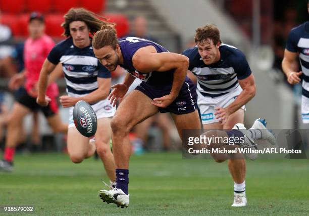 Griffin Logue of the Dockers and Jed Bews of the Cats compete for the ball during the AFLX match between the Geelong Cats and the Fremantle Dockers...