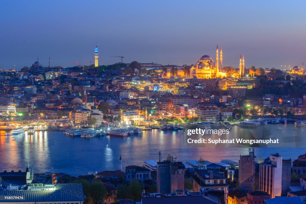 Istanbul Turkey capital city, mosque river and buildings purple and pink view skyline and skyscrapers in cityscape.