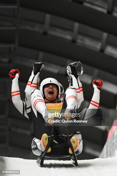 Peter Penz and Georg Fischler of Austria celebrate as they finsih a run during the Luge Team Relay on day six of the PyeongChang 2018 Winter Olympic...