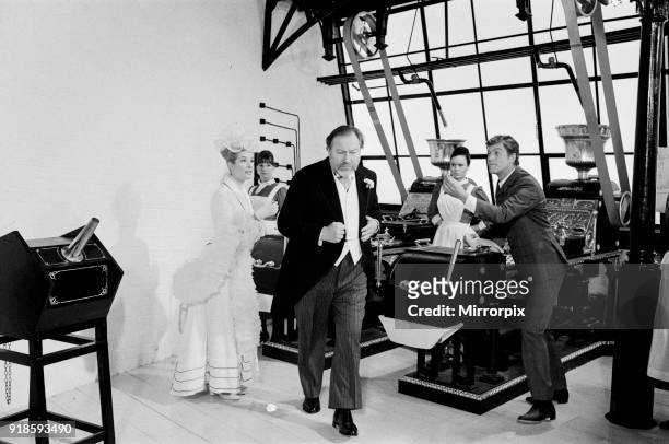 Dick Van Dyke , Sally Ann Howes and James Robertson Justice filming a scene for Chitty Chitty Bang Bang at Pinewood Studios, 19th July 1967.