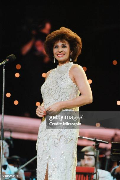 Shirley Bassey performing at the Cor World Choir concert at Cardiff Arms Park, 29th May 1993.