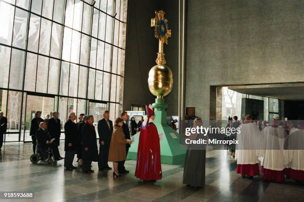 The Cross and Orb on show at Coventry Cathedral during service of reconciliation, Friday 12th February 1999. The 18ft gilded steel and copper cross...