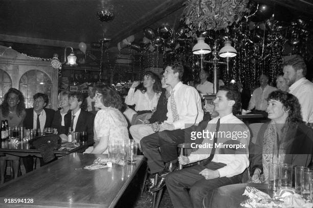 Football fans watching England in their semi-final match during the 1990 FIFA World Cup at the Three Men in a Boat pub, 4th July 1990.