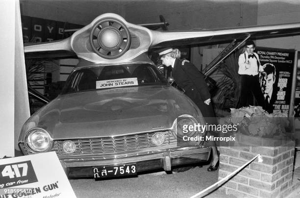 Motor Show Preview Day at Earls Court. Traffic Warden Jacqui Smith looks at the Flying Car model for the new James Bond film 'The Man With The Golden...