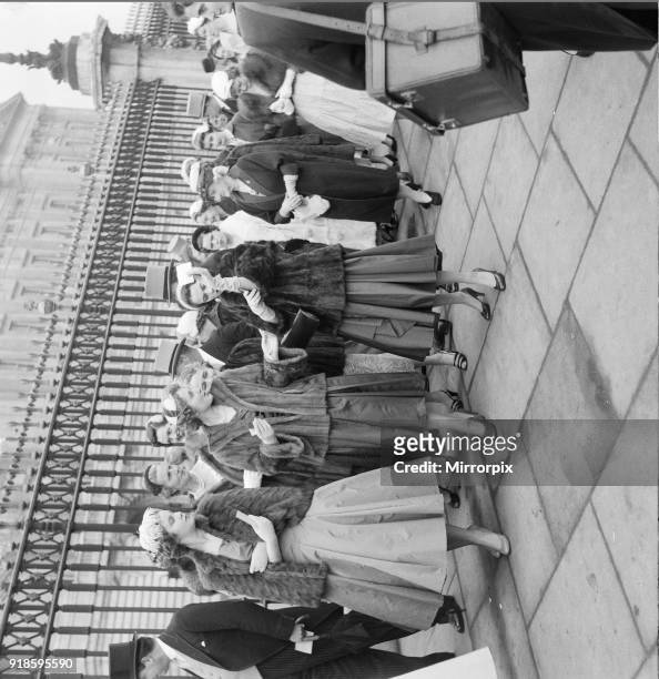 Debutantes queue at Buckingham Palace this morning to meet Queen Elizabeth II Picture taken 22nd March 1956.