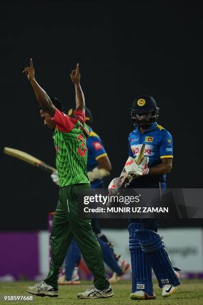 Bangladesh cricketer Rubel Hossain celebrates after the dismissal of the Sri Lanka cricketer Niroshan Dickwella during the first Twenty20 cricket...