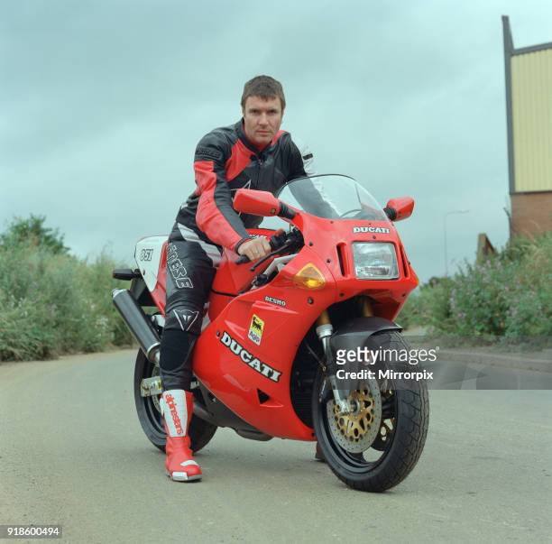 Simon Le Bon from Duran Duran on a Ducati Motobike. It is not clear if this is Simon's bike, but Simon does ride motorbikes, 12th July 1991Simon Le...