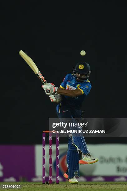 Sri Lanka cricketer Niroshan Dickwella plays a shot during the first Twenty20 cricket match between Bangladesh and Sri Lanka at the Sher-e-Bangla...