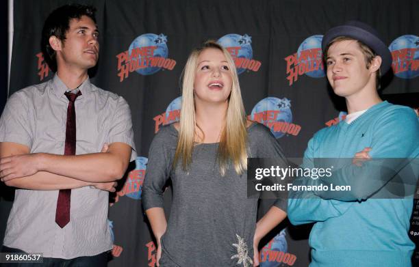 Drew Seeley, Adrian Slade and Lucas Grabeel visit Planet Hollywood on October 13, 2009 in New York City.