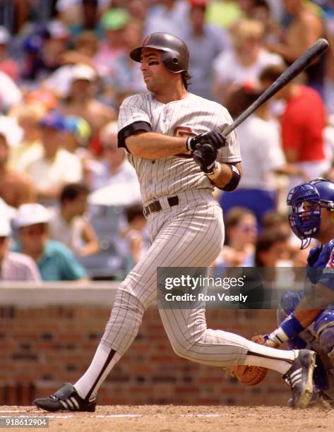 Jack Clark of the San Diego Padres bats during an MLB game versus the Chicago Cubs at Wrigley Field in Chicago, Illinois during the 1990 season.