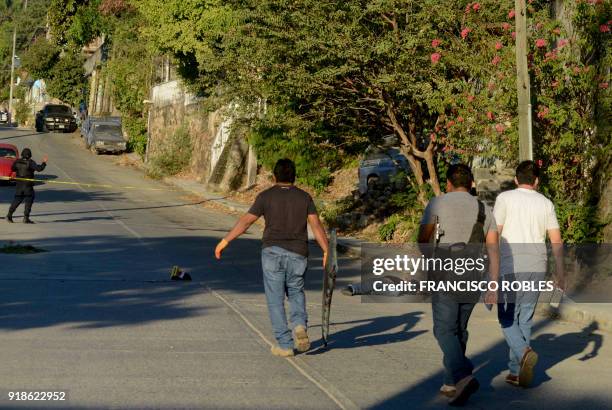 Graphic content / Investigators arrive at the crime scene where two women and a man were killed on Rufo Figueroa neighborhood of Acapulco, Guerrero...