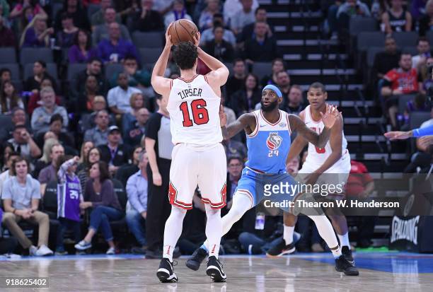 Paul Zipser of the Chicago Bulls looks to pass the ball over the top of JaKarr Sampson of the Sacramento Kings during an NBA basketball game at...