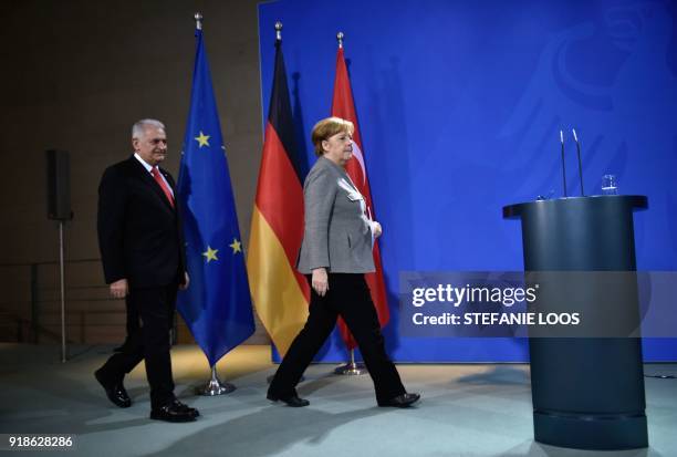 German Chancellor Angela Merkel and Turkish Prime Minister Binali Yildirim arrive to give a press conference on February 15, 2018 at the Chancellery...