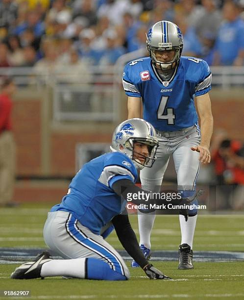 Jason Hanson of the Detroit Lions prepares to kick a field goal while Nick Harris signals for the snap against the Pittsburgh Steelers at Ford Field...