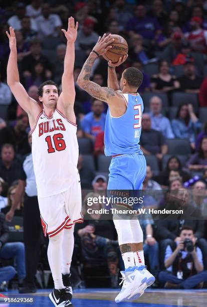 George Hill of the Sacramento Kings shoots over Paul Zipser of the Chicago Bulls during an NBA basketball game at Golden 1 Center on February 5, 2018...