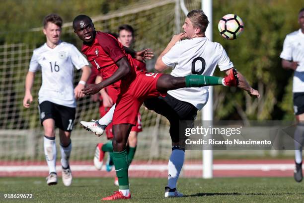 Merveille Papela of Germany U17 challenges Henrique Jocu of Portugal U17 during U17-Juniors Algarve Cup match between U17 Portugal and U17 Germany at...