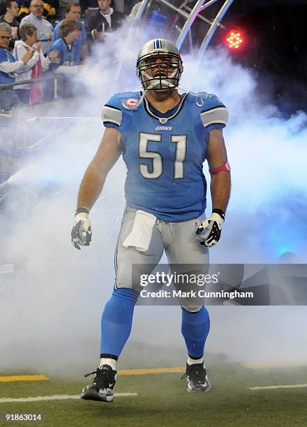 Dominic Raiola of the Detroit Lions looks to the crowd during player introductions before the game against the Pittsburgh Steelers at Ford Field on...