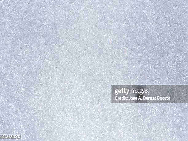 background full frame of snow covered ground illuminated by sunlight. spain - frosty ストックフォトと画像