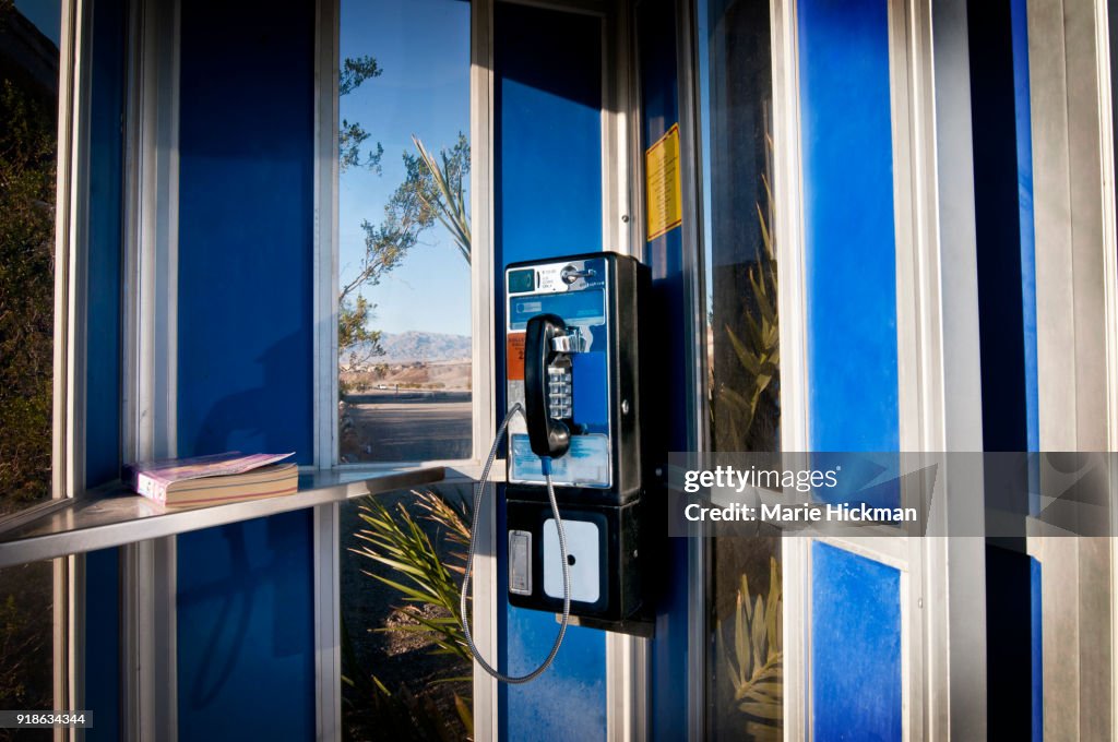 Vintage TELEPHONE BOOTH with telephone book.