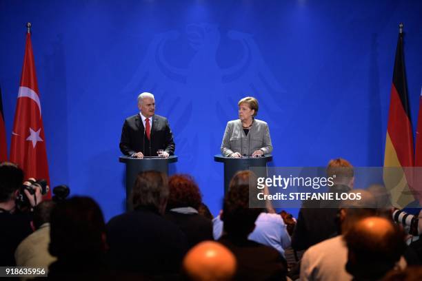 German Chancellor Angela Merkel and Turkish Prime Minister Binali Yildirim give a press conference on February 15, 2018 at the Chancellery in Berlin....