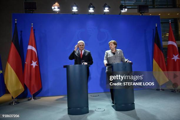 German Chancellor Angela Merkel and Turkish Prime Minister Binali Yildirim give a press conference on February 15, 2018 at the Chancellery in Berlin....