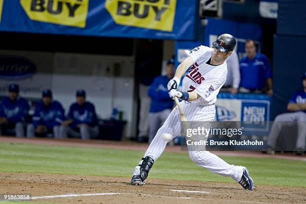 Joe Mauer of the Minnesota Twins bats against the Kansas City Royals on October 4, 2009 at the Metrodome in Minneapolis, Minnesota. The Twins won...