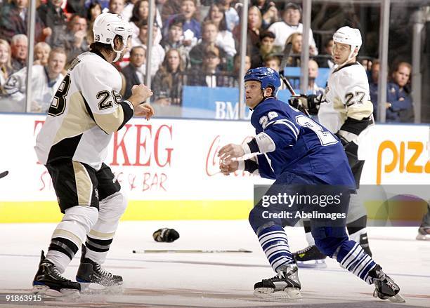 Colton Orr of the Toronto Maple Leafs fights Eric Godard of the Pittsburgh Penguins during a NHL game at the Air Canada Centre on October 10, 2009 in...