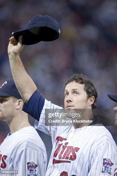 Joe Nathan of the Minnesota Twins tips his cap to the crowd as the team takes to the field against the Kansas City Royals on the last scheduled...