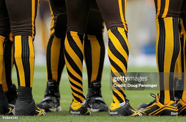 Wide receiver Jabar Gaffney of the Denver Broncos put a twist on the socks of his throwback uniforms as the Broncos face the New England Patriots...