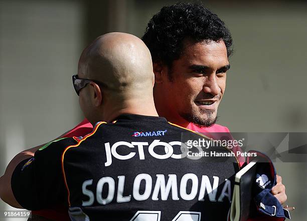 Auckland rugby player Jerome Kaino greets former rugby league player Monty Betham during a celebrity Tsunami Relief rugby training session at Unitec...