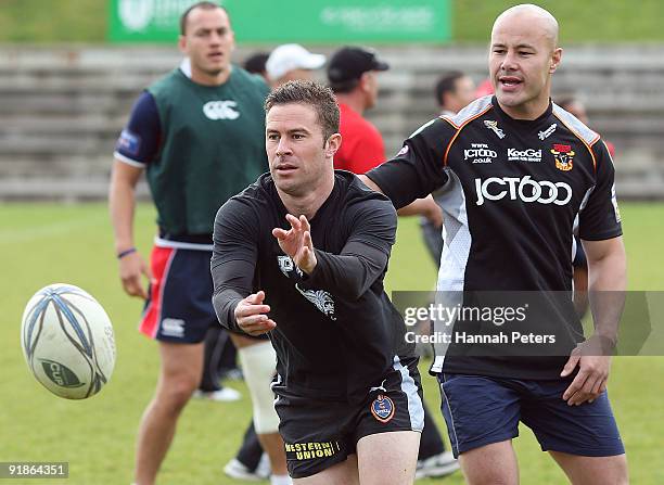 Former New Zealand soccer player Noah Hickey passes the ball out during a celebrity Tsunami Relief rugby training session at Unitec on October 14,...