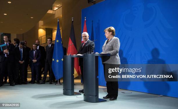 German Chancellor Angela Merkel and Turkish Prime Minister Binali Yildirim give a press conference on February 15, 2018 at the Chancellery in Berlin....