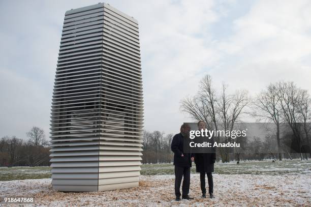 The Dutch artist, Daan Roosegaarde and the Dutch Ambassador for Poland, Ron van Dartel pose for a photo next to the Smog free tower, the first...