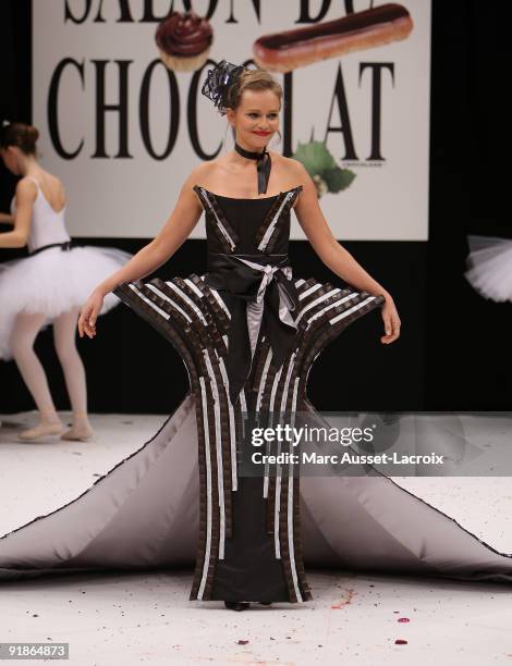 Claire Borotra displays a chocolate decorated dress during the Chocolate dress fashion show celebrating Salon Du Chocolat 15th Anniversary - Opening...