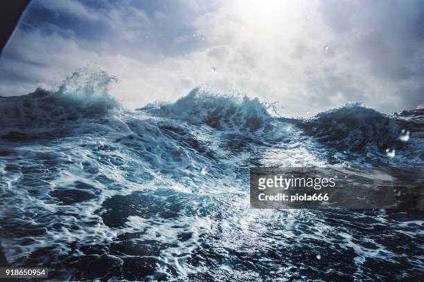 blu rough sea - ruffled stock pictures, royalty-free photos & images