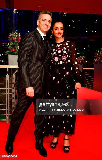 Berlin politician and member of the German Social Democrats Sawsan Chebli and her husband Nizar Maarouf pose on the red carpet for the opening...