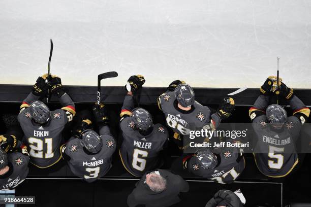 Brendan Leipsic, Cody Eakin, Brayden McNabb, Colin Miller, Nate Schmidt, Brad Hunt, and Deryk Engelland of the Vegas Golden Knights watch from the...