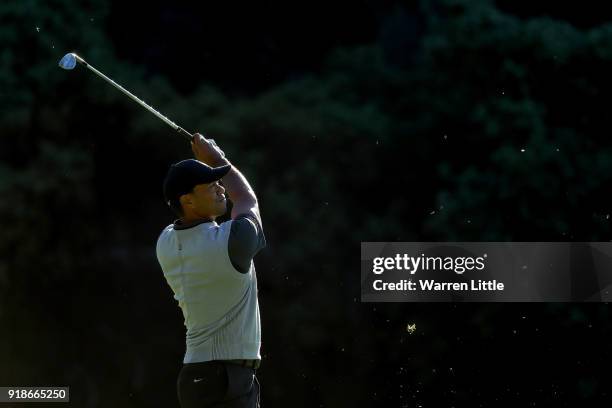 Tiger Woods plays his shot on the 13th hole during the first round of the Genesis Open at Riviera Country Club on February 15, 2018 in Pacific...