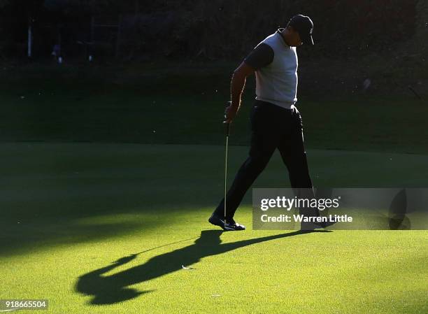 Tiger Woods walks across the 12th hole during the first round of the Genesis Open at Riviera Country Club on February 15, 2018 in Pacific Palisades,...