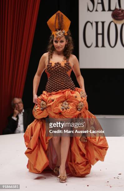 Coralie Clement displays a chocolate decorated dress during the Chocolate dress fashion show celebrating Salon Du Chocolat 15th Anniversary - Opening...