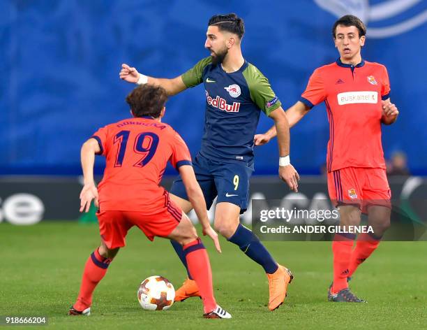 Salzburg's Israeli forward Munas Dabbur vies with Real Sociedad's Spanish defender Alvaro Odriozola during the UEFA Europa League first leg round of...