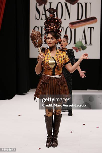 Daniela Lumbroso displays a chocolate decorated dress during the Chocolate dress fashion show celebrating Salon Du Chocolat 15th Anniversary -...