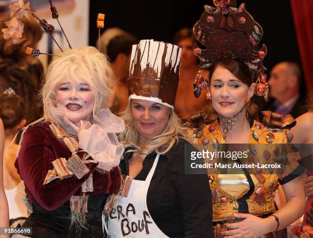 Armande Altai and Valerie Damidot and Daniela Lumbroso displays a chocolate decorated dress during the Chocolate dress fashion show celebrating Salon...